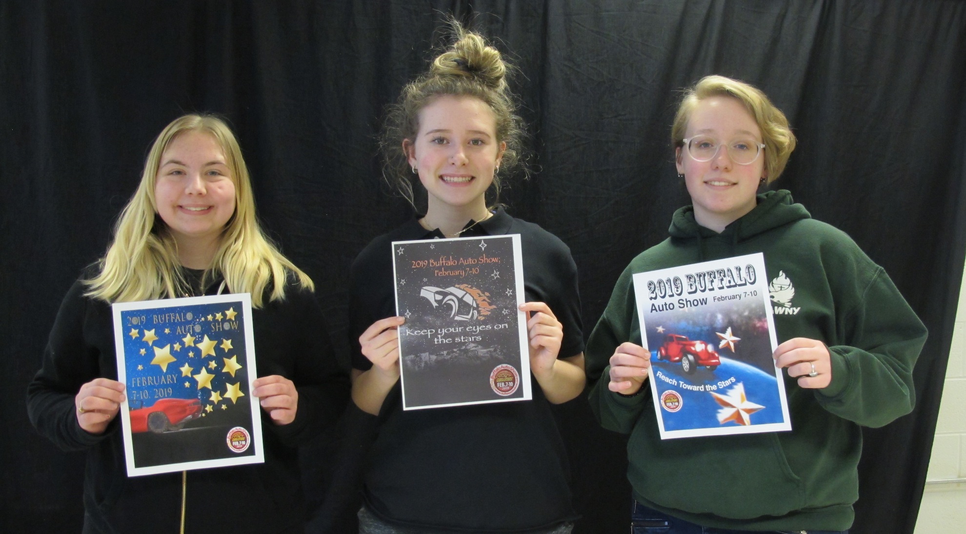 Savannah Porter, Emily Baumgartner and Zoe Feltz pose with their awards for the NFADA Poster Contest.